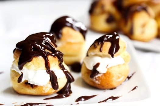 Profiteroles,On,White,Background,,Selective,Focus